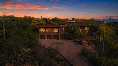 Discover this unique desert home, surrounded by lush landscapes and stunning sunset vistas, perfect for outdoor enthusiasts.