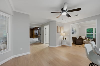 Bright and inviting living space featuring modern lighting and an open layout ideal for entertaining.