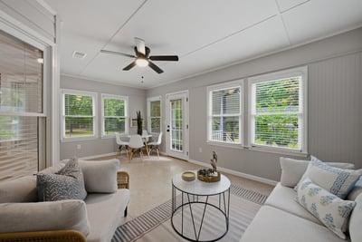 Sunroom with ample natural light, perfect for relaxation or entertaining guests.