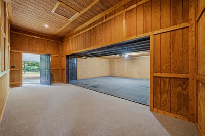 Spacious flex space perfect for a workshop, studio, or weight room.