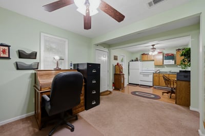 Cottage features a covered front porch, an open living area, kitchenette, private bedroom, and full bath. A versatile space that offers flexibility and functionality, perfect for hosting guests, working from home, or creating a studio or hobby space.