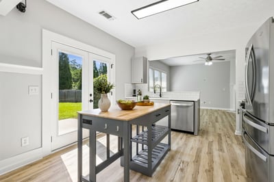 A kitchen island adds an extra countertop space for meal prep, baking, or entertaining.