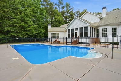 This luxury home features a spacious backyard with a refreshing salt water pool, perfect for relaxation and entertaining.