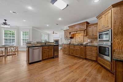 Open concept kitchen with sub-zero fridge.