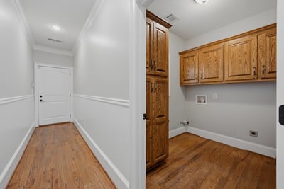 Laundry room on the main level with plenty of storage