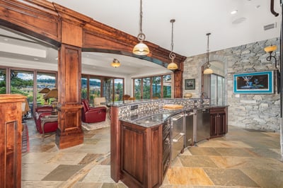 Discover a beautifully designed full bar/kitchen that seamlessly blends luxury with breathtaking views, natural light, and functionality.