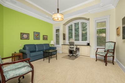 Main floor ensuite bedroom facing the street. The green wall has been painted white.