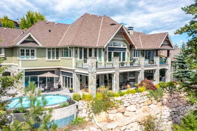 Spacious multi-level home features stunning outdoor spaces, a pool, and beautiful landscaping, perfect for entertaining.