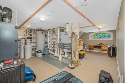 Spacious multi-purpose attic featuring ample storage, mechanical equipment, and a versatile art/work area for projects. easy access via stairway.