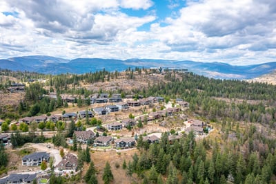 Breathtaking hillside community boasting stunning panoramic views and a blend of natural beauty and modern homes.