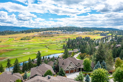 Discover this stunning hillside home with breathtaking views of lush golf greens and picturesque landscapes.