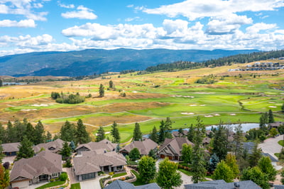 Stunning hillside view overlooking lush golf course and scenic mountains, offering a perfect backdrop for your dream home.