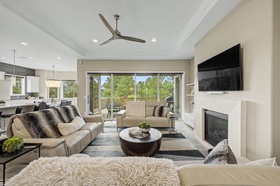 Bright and inviting living space featuring large windows that offer scenic views and modern amenities.