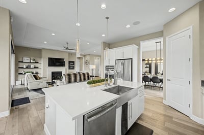 This modern kitchen features sleek countertops, stainless steel appliances, and an open layout ideal for entertaining.
