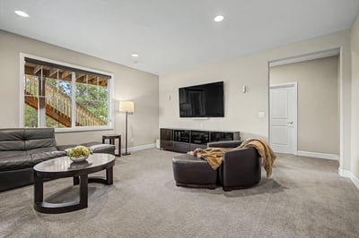 Bright and inviting living space features modern amenities and generous natural light from large windows.