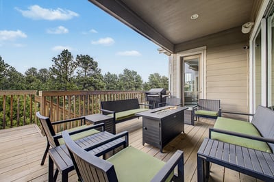 Spacious outdoor deck features comfortable seating and scenic views, perfect for relaxing or entertaining.