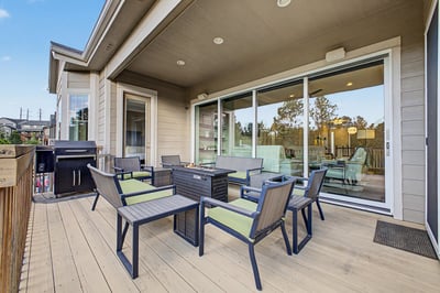Spacious outdoor patio with comfortable seating, perfect for entertaining or relaxing while enjoying scenic views.