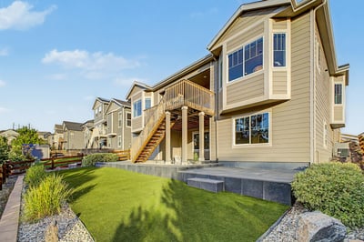 This modern home features expansive outdoor areas, ideal for relaxed living and entertaining in a vibrant community.