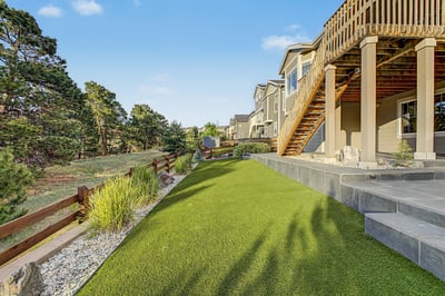 Discover a spacious outdoor retreat featuring a well-maintained lawn and scenic views, perfect for relaxation.