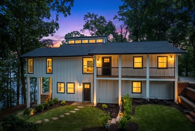 Discover this unique lakeside retreat featuring modern design, spacious outdoor areas, and breathtaking sunset views.