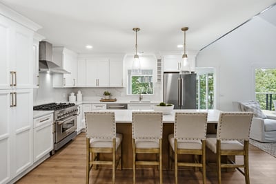 Bright, modern kitchen featuring ample counter space, high-end appliances, and a spacious island perfect for gatherings.