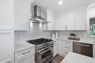 Modern kitchen featuring sleek cabinetry, high-end stainless steel appliances, and spacious countertops for culinary creativity.