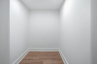 Versatile space ideal for storage or as a creative nook, featuring sleek flooring and clean lines.