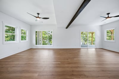 Spacious living area with abundant natural light and seamless access to outdoor views.