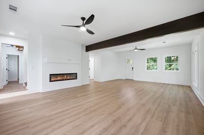 Spacious open layout features natural light, modern finishes, and an inviting fireplace for cozy gatherings.