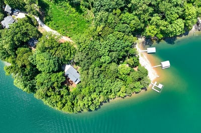 Discover this unique waterfront property, featuring lush greenery and private docks for endless relaxation and recreation.