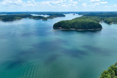 Breathtaking waterfront views and ample natural surroundings create a perfect retreat for outdoor enthusiasts and tranquility seekers.