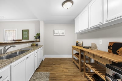 Modern kitchen featuring granite countertops, ample storage, and a practical open layout for cooking and entertaining.