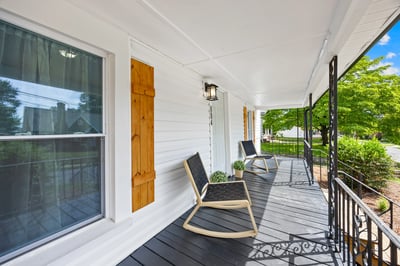 Relax on the spacious front porch, perfect for enjoying morning coffee and neighborhood views.