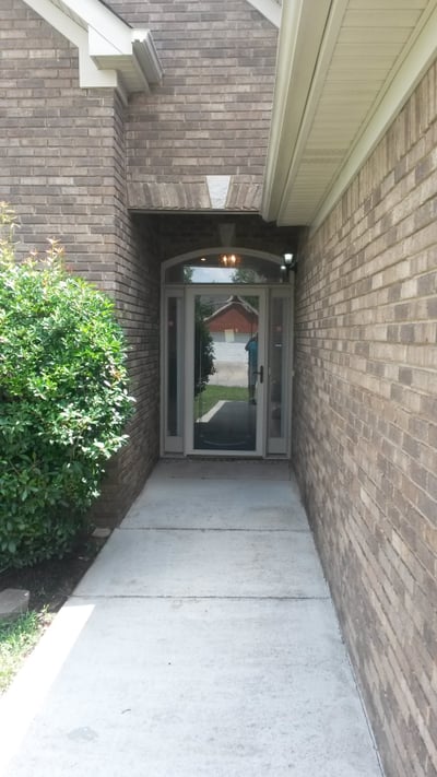 Welcome to a well-maintained entrance that seamlessly connects indoor and outdoor living spaces.