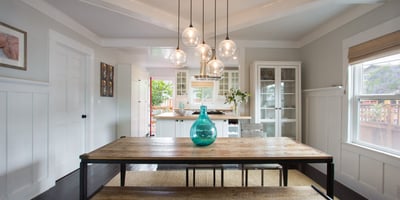 Open and spacious living and dining area. Original craftsman ceilings.