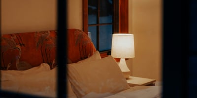 Cozy bedroom featuring inviting lighting and a warm ambiance, perfect for relaxation and restful nights.
