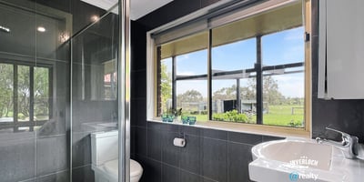 Bright bathroom featuring modern fixtures and scenic views, perfect for relaxation and comfort.