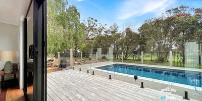 Spacious indoor-outdoor living with modern pool views, surrounded by lush greenery and serene landscapes.