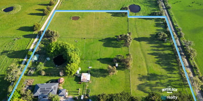 Expansive property featuring lush pastures and water features, perfect for agricultural pursuits or private retreat.
