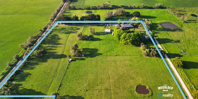 Spacious rural property featuring vast grassy fields, multiple water features, and expansive potential for development.