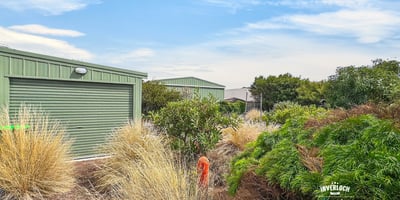 Discover a unique property featuring modern buildings set amidst vibrant landscaping for a relaxed lifestyle.