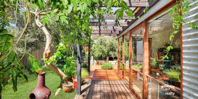 Bright and inviting outdoor space with lush greenery, perfect for relaxation and entertaining.