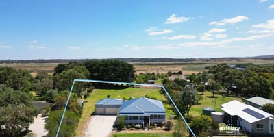 Spacious property featuring a well-maintained home and expansive outdoor space, perfect for relaxation and entertaining.