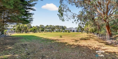 Spacious vacant lot with mature trees, offering limitless potential for your dream home or investment opportunity.