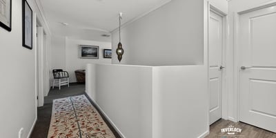 Bright and spacious hallway featuring modern decor and a welcoming atmosphere, perfect for any home.