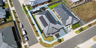 Modern home with rooftop solar, spacious yard, and convenient access to nearby amenities and recreational areas.