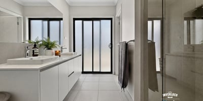 Light-filled bathroom featuring modern fixtures and a spacious layout, perfect for relaxation and convenience.