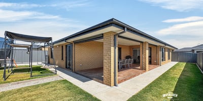 Spacious outdoor area with a covered patio, perfect for entertaining and enjoying family gatherings year-round.
