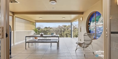 Spacious outdoor patio with scenic views, perfect for entertaining or relaxing in a tranquil atmosphere.