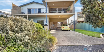 Spacious two-story home featuring expansive outdoor areas and modern amenities, perfect for entertaining or relaxing.